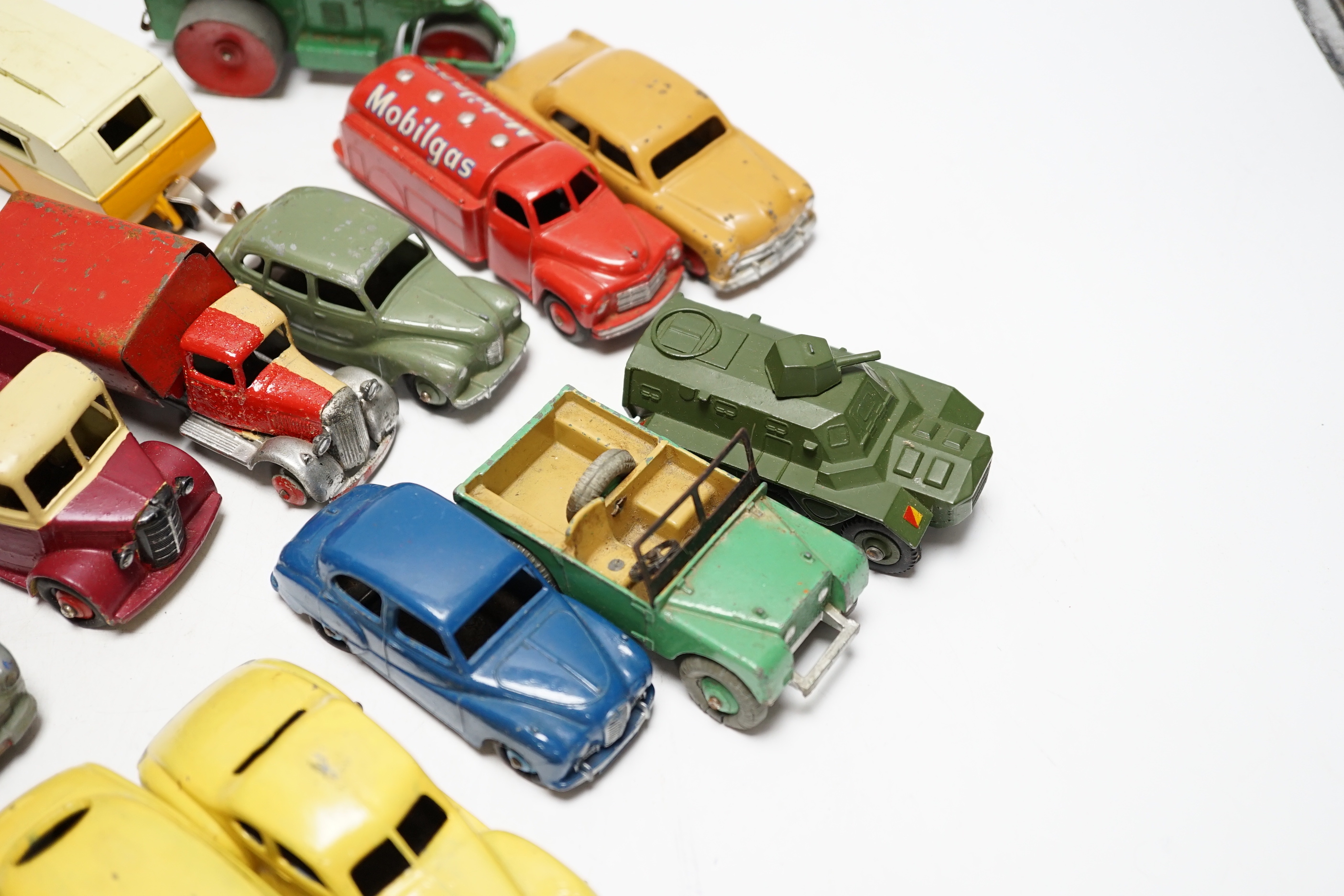 Nineteen Dinky Toys including; Mobilgas Tanker, Ford Sedan, Austin Devon, Austin Somerset, Standard Vanguard, Bedford Tipper, Hudson Sedan, etc.